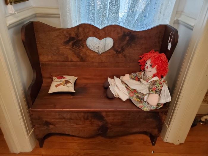 wood bench and cloth raggedy ann doll