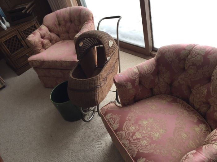 two swivel pink chairs