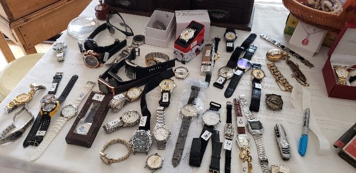 Lots of watches and pocket knives