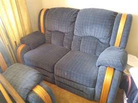 This settee dual recliner blue color is much more vibrant in person and in great condition.