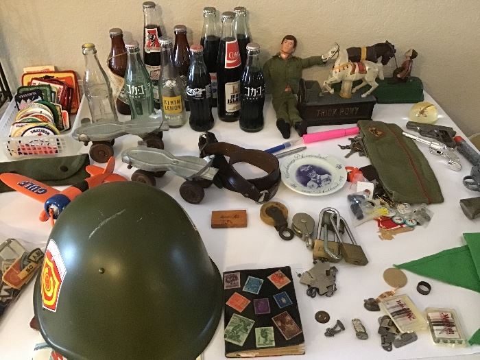 Boy Scout stuff, army helmet, vintage Gijoe, coke bottles, two mechanical banks
