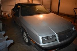 1981 Chrysler Le Baron with an extremely low serial number. Mr Shelhart owned approx. 6 important patents and the hydraulic that operated the  Le Baron Convertible is one of them, as is the Maserati. In honor of this, the Chrysler Corp. gave Mr. Shelhart one of the Le Baron's and put original Maserati Wheels on it.