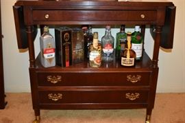 A closer look at the Collectible Bottles and the Gorgeous Tea Cart with Drop Leaf Ends and 2 Drawers