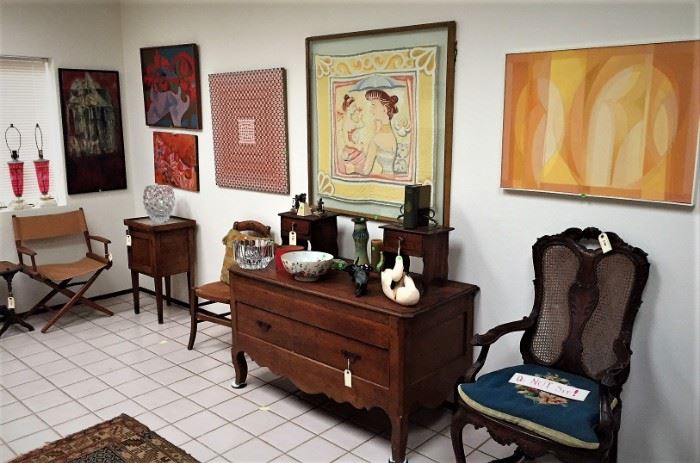 modern and abstact paintings with large dressing bureau and chairs