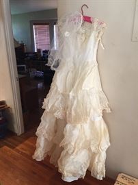 This Gown was worn in 1957.  Yellowed with age but can be brought back to life wth cleaning.