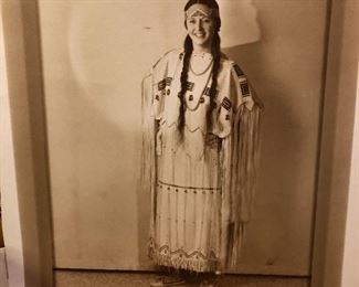 Signed hand colored portrait of ancestor in native  dress. 