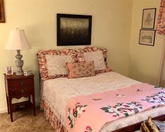 Hepplewhite bedroom furniture with handmade appliqué quilt and crocheted coverlet with shams. 