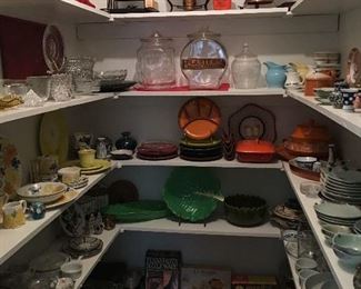 Butlers pantry full of serving pieces, china from around the world and collectible art glass and pottery