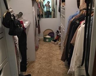 Closet with furs, cocktail purses, ties, shoes and other items.