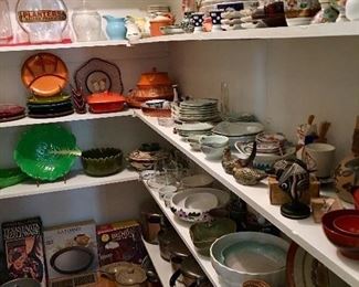 Butlers pantry full of serving pieces, china from around the world and collectible art glass and pottery