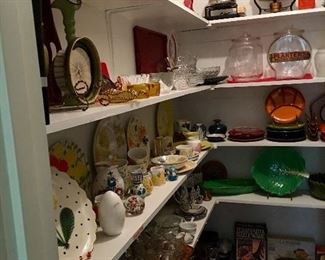 Butlers pantry full of serving pieces, china from around the world and collectible art glass and pottery