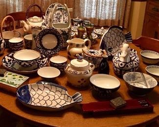 Table full of blue and white china serving pieces