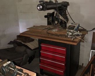 Radial arm saw and cabinet