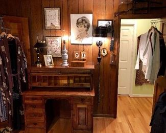 Front view of antique walnut cylinder top desk with figured walnut accents. 