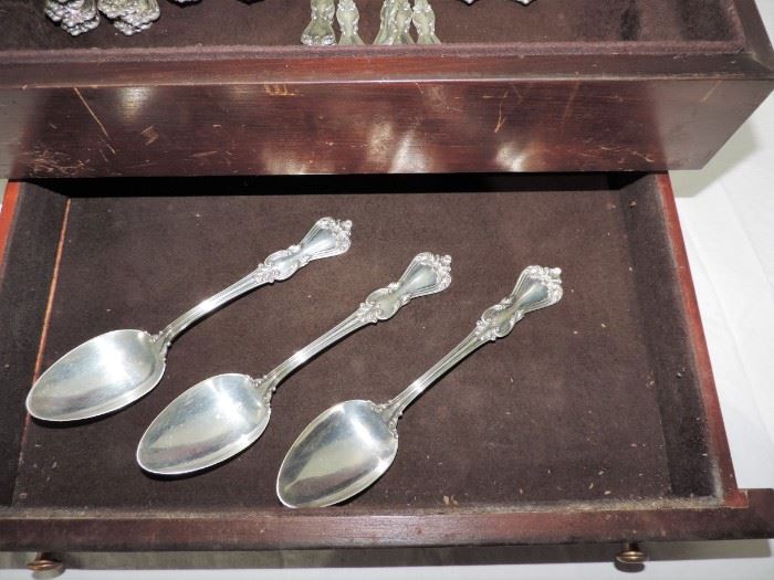 SHOWING STERLING TABLE SPOONS