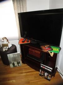 Flat Screen TV .. Credenza for TV/and equipment ..Collection of Tapes, Albums, Books, etc... 