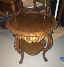 Antique round, carved side table