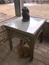 Wicker side table w/glass top. Rabbits
