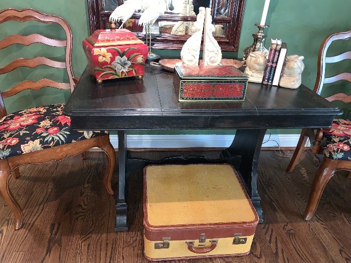 Vintage luggage- put some legs on it and it makes a great side or coffee table