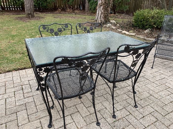 Outstanding vintage Wrought Iron and glass aptio set w/ 4 chairs