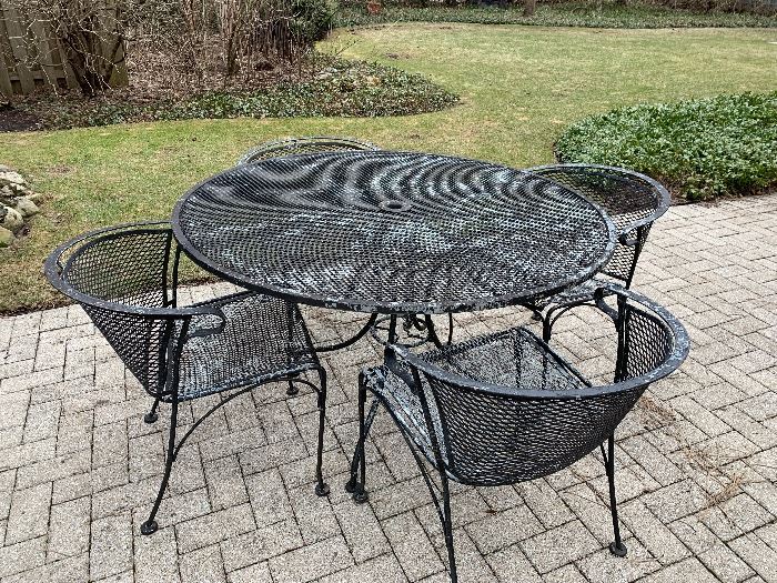 Wrought Iron round patio set with 4 barrel chairs
