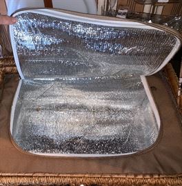Picnic basket filled w/plastic ware and insulated bottom