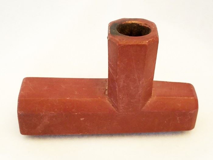 Guaranteed authentic (not a reproduction) catlinite Indian pipe from Wyoming. 3 1/2" long, 2 1/4" tall to top of bowl, and 1 1/4" wide.