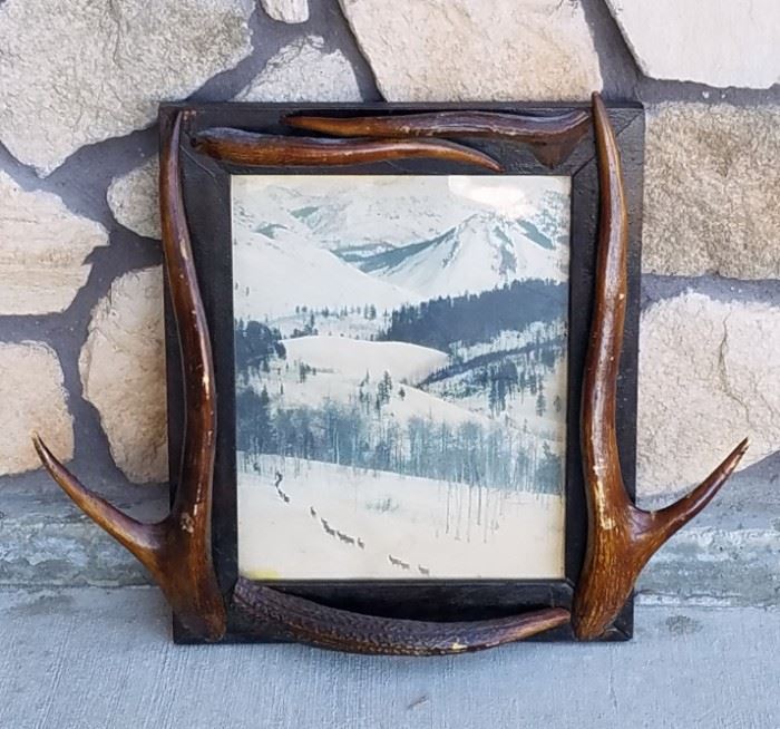 Stephen N. Leek photograph of elk in a frame with elk antler points from the historic Leeks Lodge in Jackson, Wyoming.