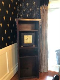 There's a wine rack on top of that display shelf, you need that