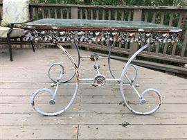 antique iron-based glass top patio table. Beautiful shabby chic this one