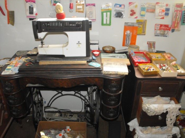 antique sewing cabinet, no machine, modern machine is a Viking