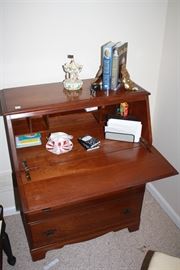 We are calling this a secretary, since it folds down into a desk.  Most, if not all of the furntiure in the house is from the 1950's and condition is uniformly good.