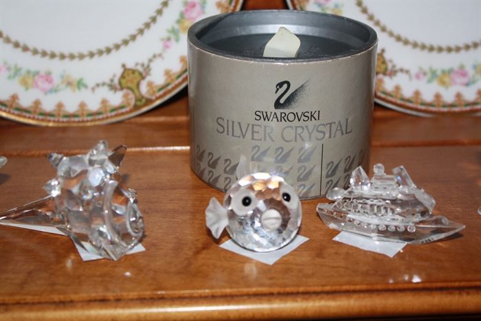 Several pieces of small Swarovski crystal.  Several of them have boo-boos.  But all are cute.