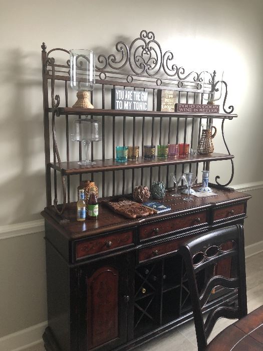 Unique and stylish piece.,used as a bar but perfect for any room in the house. Iron and wood with lots of storage. Beautiful faux finish detail. 