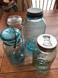 Very old and unique mason jars. Some have glass inserts in top