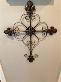 Scrolled iron cross on the hallway