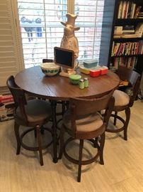 Very nice tall table with four matching bar stools. Great for the kitchen nook or a smaller space. Would be a fun game table or a great for the first home