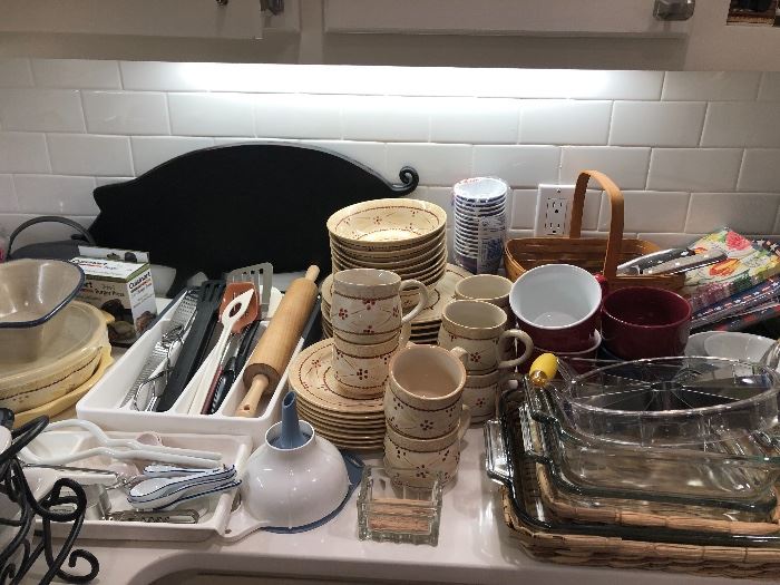 An iron pig sits behind a stack of kitchen goodies