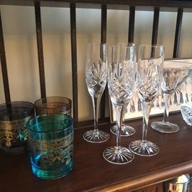 colorful rock glasses next to champagne flutes