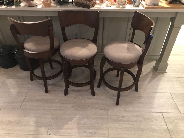 Three bar stools with very comfortable seats.