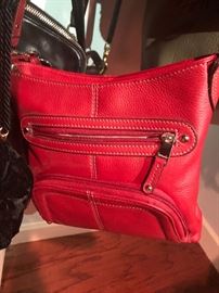a beautiful red Coach bag