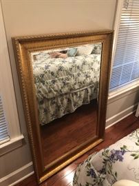 Heavy and beautiful gold leaf mirror with nice bevel. Never used. Unpacked from the original box.