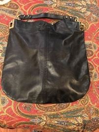 One of many designer bags-including BCBG, Tahari, Badgley Mischka and many more