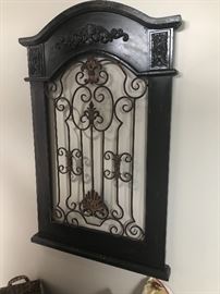 another wood and iron wall hanging.