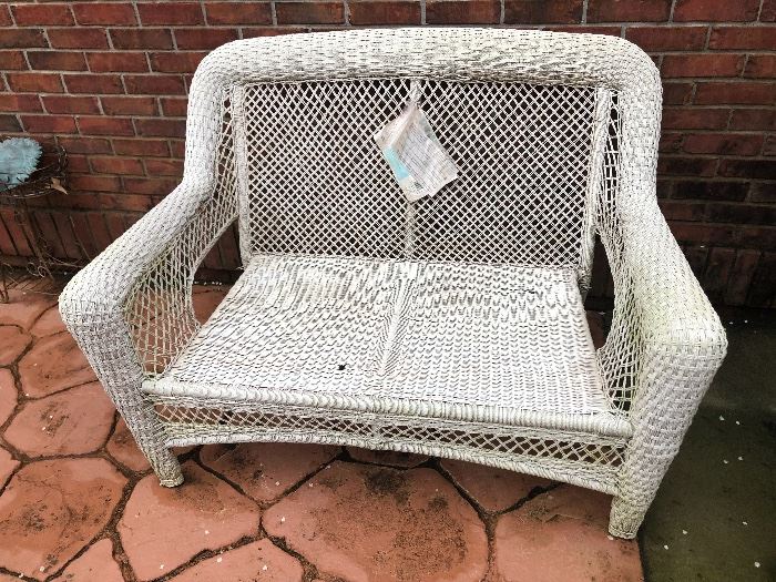 a white wicker settee. sturdy. has original tags. just needs a quick spray of paint and it will be like new
