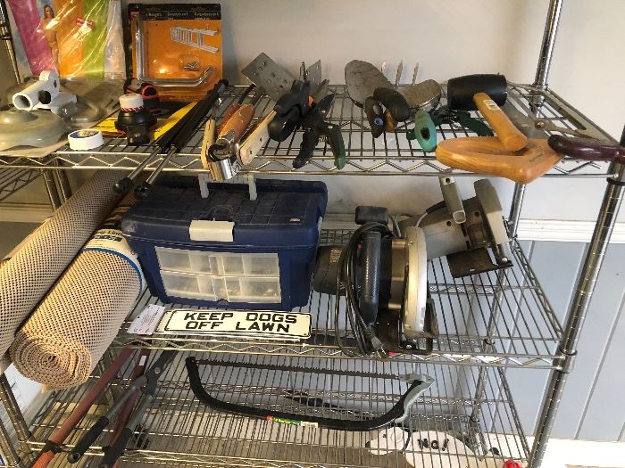 a shelf full of outdoor tools