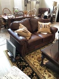 Another view of the family room and the leather love seat