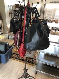 Quite a selection of designer purses. Some with tags. Some never used