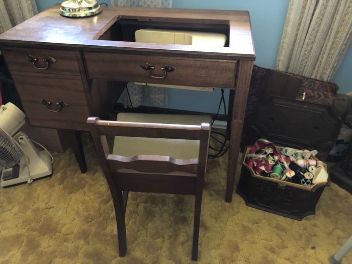 Singer sewing machine and cabinet with storage chair..