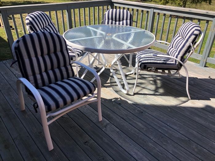 Patio table with chairs and pads